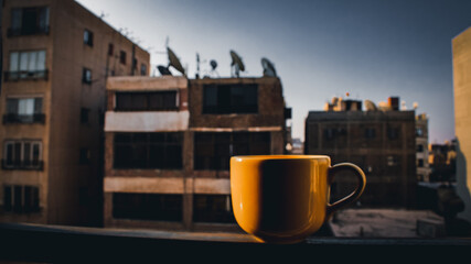 A yellow mug in the outdoor