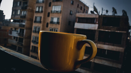 A yellow mug in the outdoor
