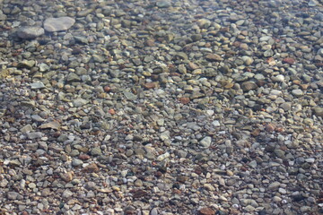 pebbles on the beach under water