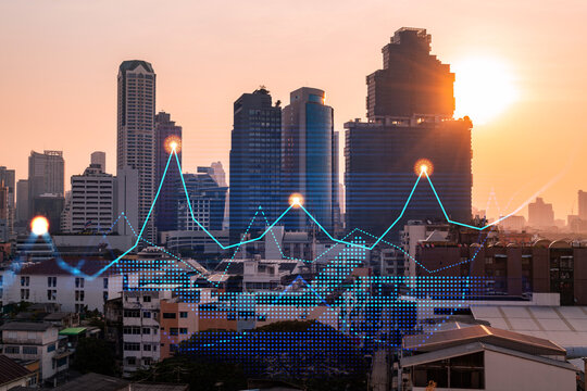 Market behavior graph hologram, sunset panoramic city view of Bangkok, popular location to achieve financial degree in Asia. The concept of financial data analysis. Double exposure.