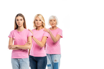 Obraz premium Women with pink ribbons of breast cancer awareness embracing isolated on white