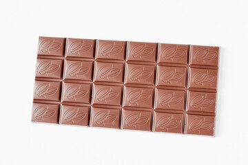 Milk chocolate bar isolated on white background