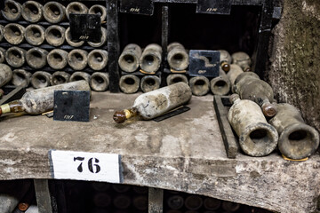 old bottles with wine stored in special cellars and stored using special technology