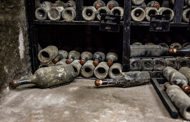 old bottles with wine stored in special cellars and stored using special technology