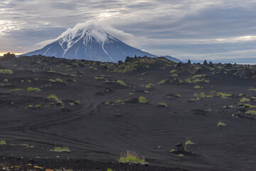 At sunrise, the cone of the Big Udina volcano