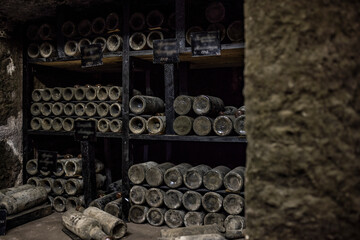 old bottles with wine stored in special cellars and stored using special technology