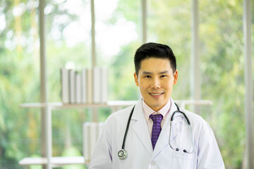 Asian medical doctor in hospital. Health care and medicine concept. new normal social distancing...