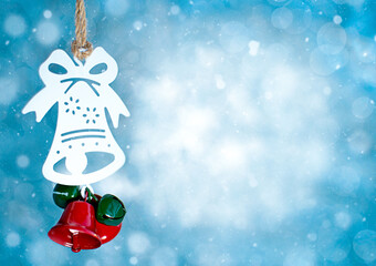 Christmas bell on a blurred background. Christmas card.