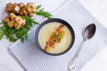 Cream of Jerusalem artichoke soup. Vegetarian dish of Jerusalem artichoke tubers.