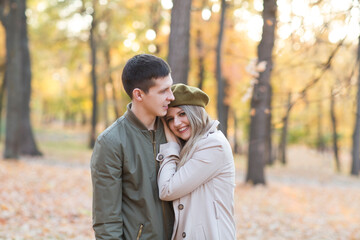 happy young couple embracing and spending time in the autumn  outdoor.