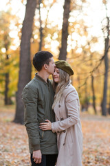 happy young couple embracing and spending time in the autumn  outdoor.