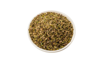 Oregano in a bowl isolated.