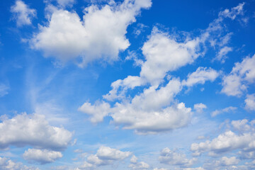 Blue sky background with clouds. Space for text