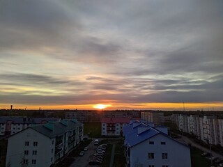 dawn over a small and calm city view from the roof of a multistory building