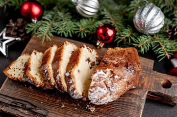 Christmas cupcake on a background of a stone with a Christmas tree, Christmas decorations, gifts