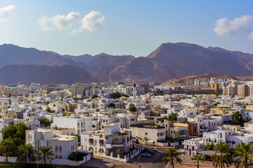 Fototapeta na wymiar An early morning view across Muscat, Oman towards the distant mountains in late summer