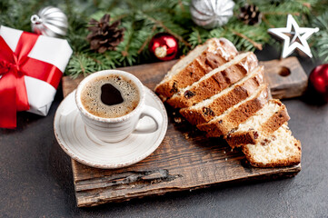 Christmas breakfast coffee and cupcake on a stone background with a Christmas tree, Christmas decorations, gifts 