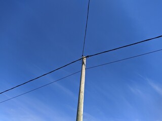 electronic pole with wires against the sky