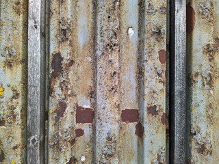 Colored rusty stained metal wall texture pattern