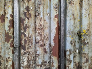 Colored rusty stained metal wall texture pattern