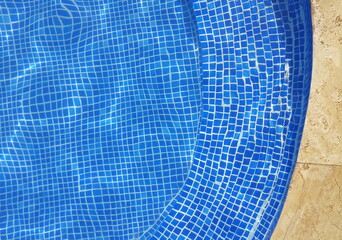 Fototapeta premium rippling water in blue stony pool
