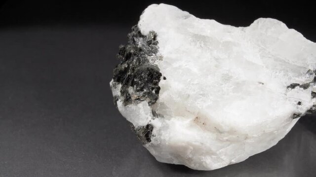 Moonstone on a dark background. Adular close-up.
