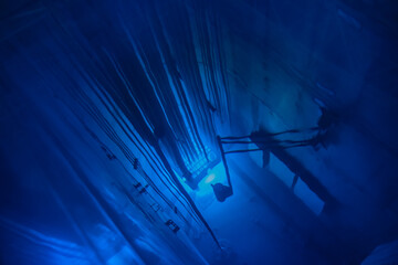 Blue glow water of nuclear reactor core powered, caused by Cherenkov radiation, fuel plates...