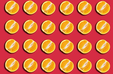 Pattern of fresh orange halves on a red background with a shadow.
