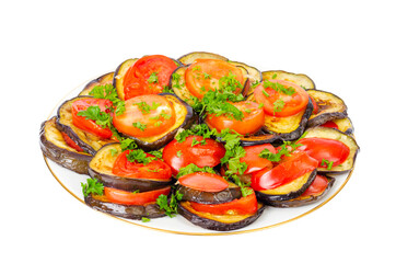 Eggplant appetizer with tomatoes on plate, white background. Studio Photo