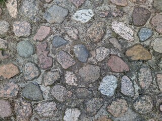 texture and background of stones rolled into the ground