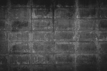 Black brick walls that are plastered background and texture. The texture of the block is black. Background of empty block basement wall.