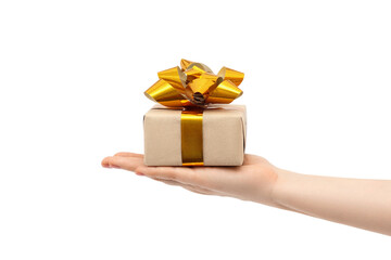 Gift with golden bows in a woman's hand.