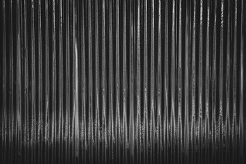 Dark corrugated metal or zinc texture surface or black galvanize steel industrial texture and background.