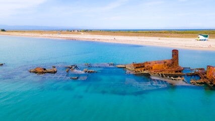 Drone pics over a shipwreck next to a tropical beach in Epanomi, Macedonia, Greece