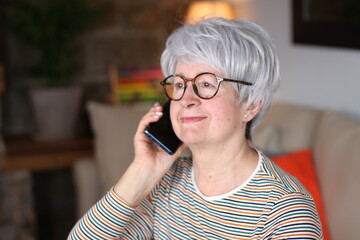 Senior woman calling from home 