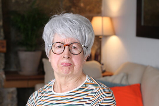 Senior woman with envious expression  