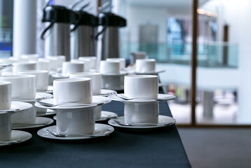Stacks of cups and saucers ready for the morning coffee rush
