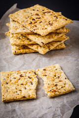 stack of healthy crackers with oat and sesame seeds