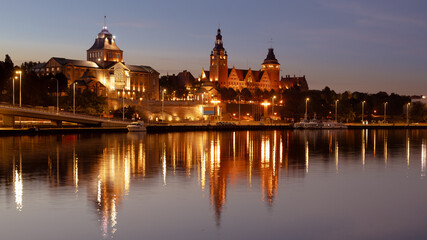 Szczecin. After dusk. A view of the Odra River and the historic part of the city, called the...