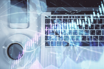 Stock market chart and top view computer on the table background. Multi exposure. Concept of financial analysis.