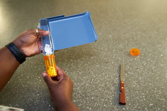 Black pharmacist prepare medication for hospital patient