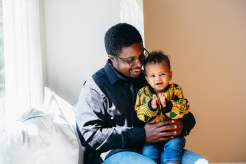 Portrait of smiling Black father and son