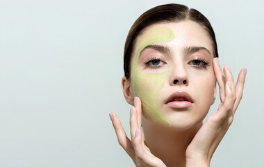 Young woman applying facial gel, peeling or mask on her face.