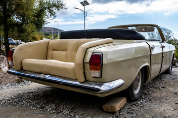 retro car with structural changes in a street parking