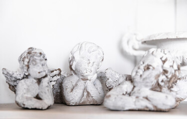 Three angel figurines