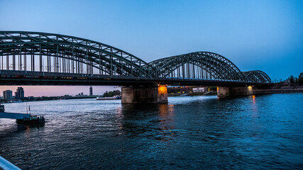 Bridge over the river Rhine at dusk in Cologne, Germany