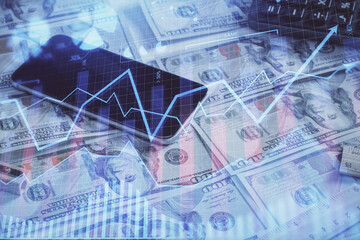 Double exposure of forex graph drawing over us dollars bill background. Concept of financial markets.