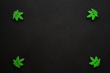 Cannabis leaves frame. Black background. Wooden decoration. Illegal. Marijuana. Cannabis sativa.