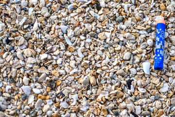 Sandy beach with trash