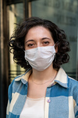 Woman wearing a protective mask on the street.